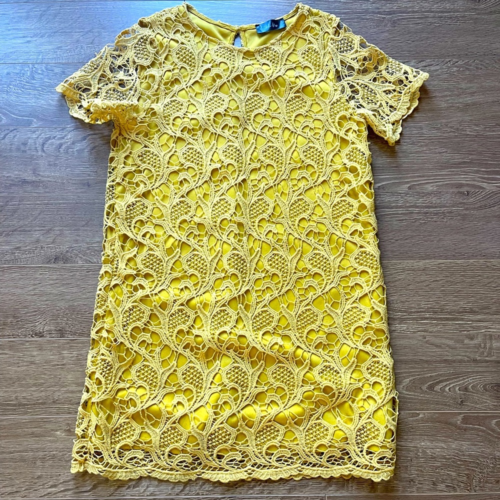 Yellow eyelet Charlie Moss mini dress.